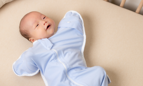baby smiling in crib