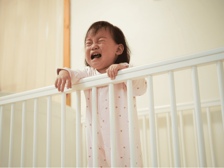 baby crying in crib olc